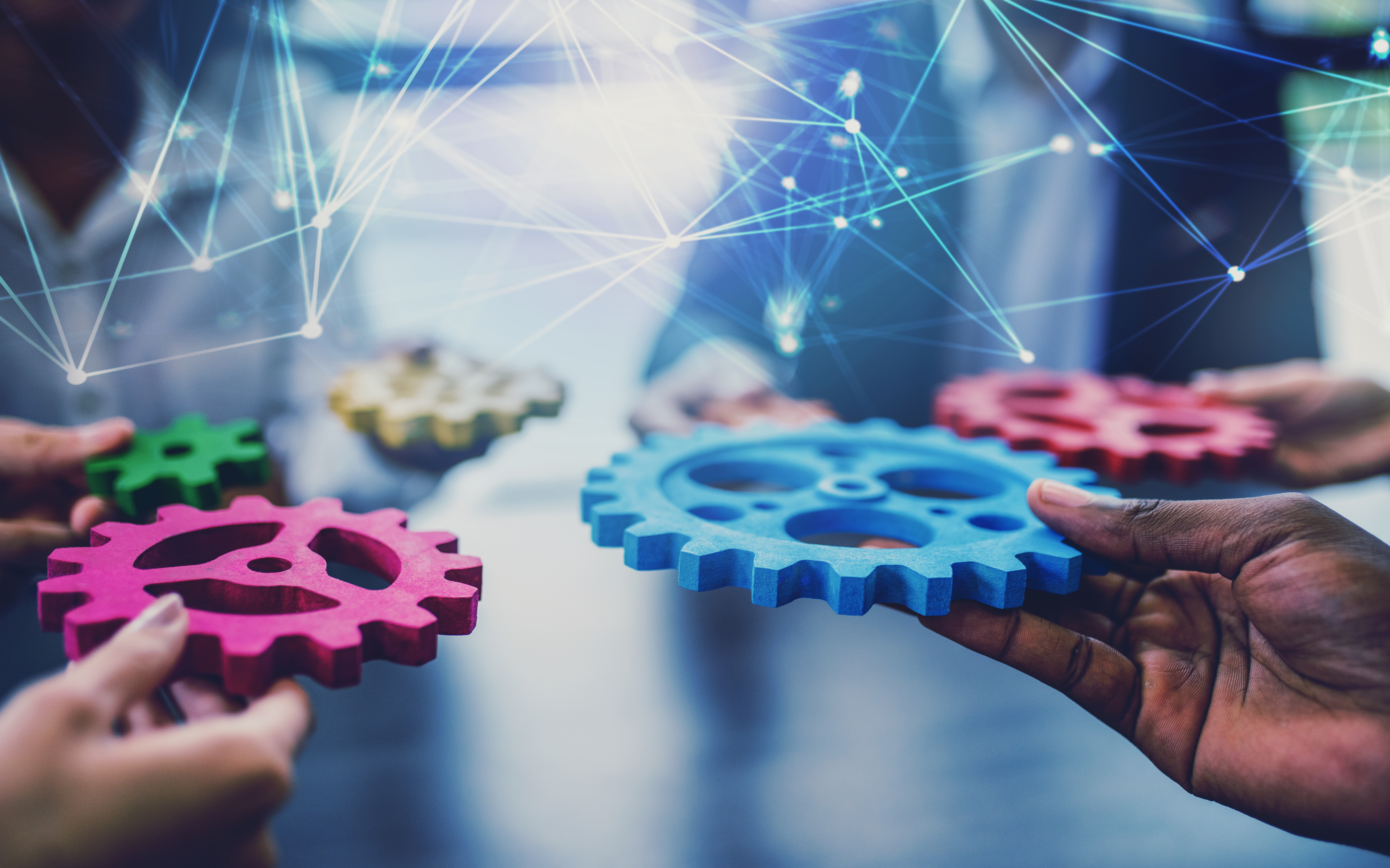 Network Hologram With Hands Holding Gears